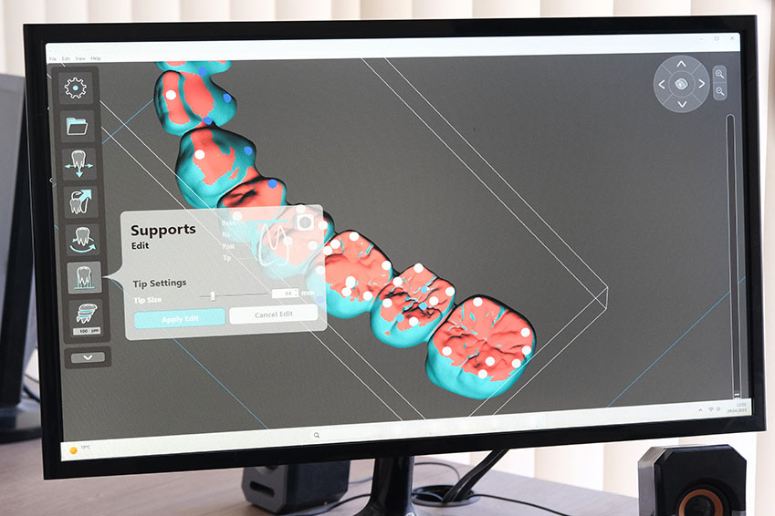The image shows a computer monitor displaying a 3D rendering of a brain with various colors highlighting different areas, alongside a user interface with options like  Support,   Settings,  and  Exit.  Below the monitor, there s a keyboard and a mouse, suggesting a workstation setup. The environment suggests an educational or research setting focused on neuroscience or cognitive science.