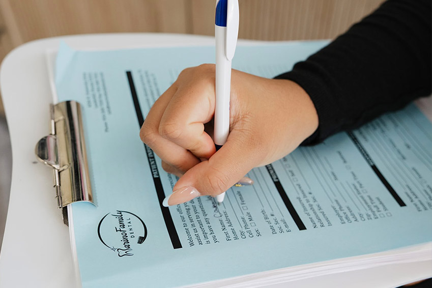 A man wearing a dental headgear with a smile on his face.