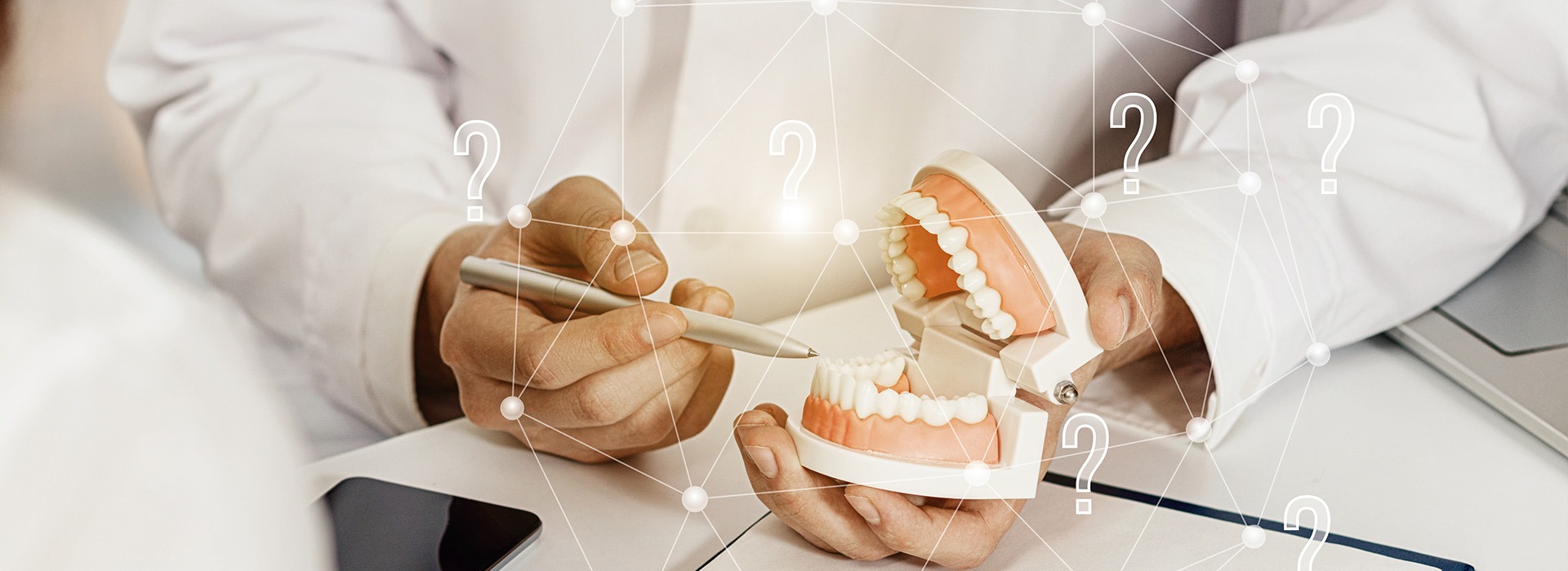 The image depicts a person holding a tooth with a magnified view of the interior, showcasing the dental anatomy, presented on a digital display with overlaying text and numbers.